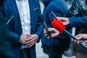 Interviewing businessman on press conference